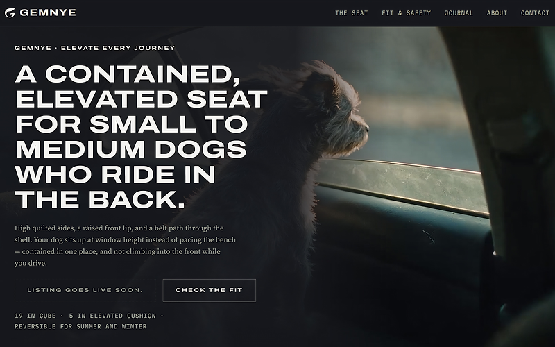 The Gemnye homepage: a dog looking out of a car window beside the headline for a contained, elevated seat for small to medium dogs